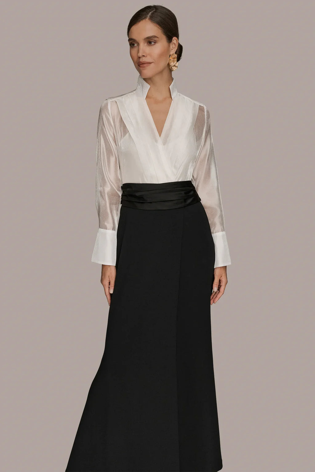 Layered wrap tuxedo evening gown featuring a sheer pleated bodice, perfect for formal occasions and elegant events. 0