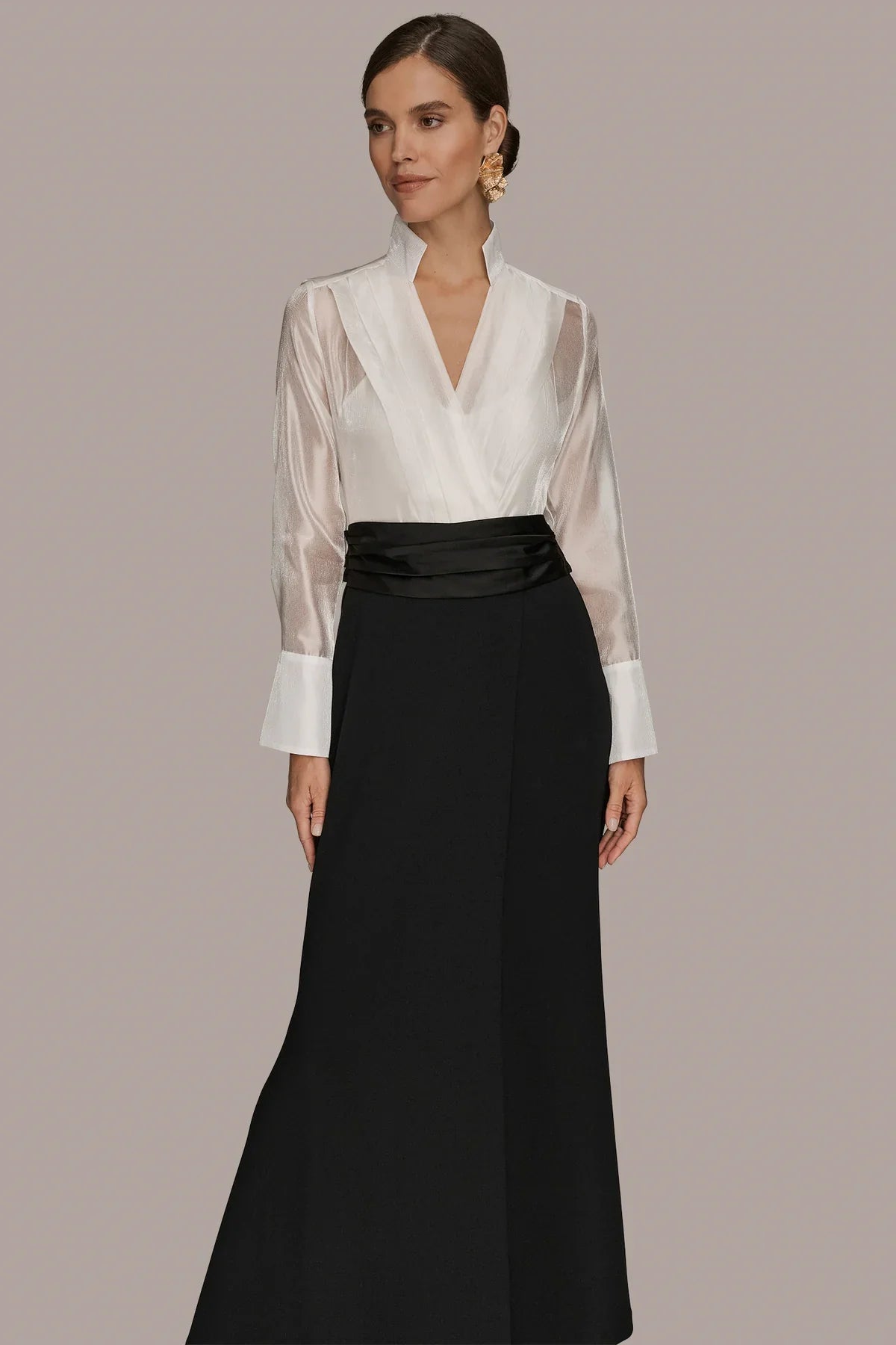 Layered wrap tuxedo evening gown featuring a sheer pleated bodice, perfect for formal occasions and elegant events. 0