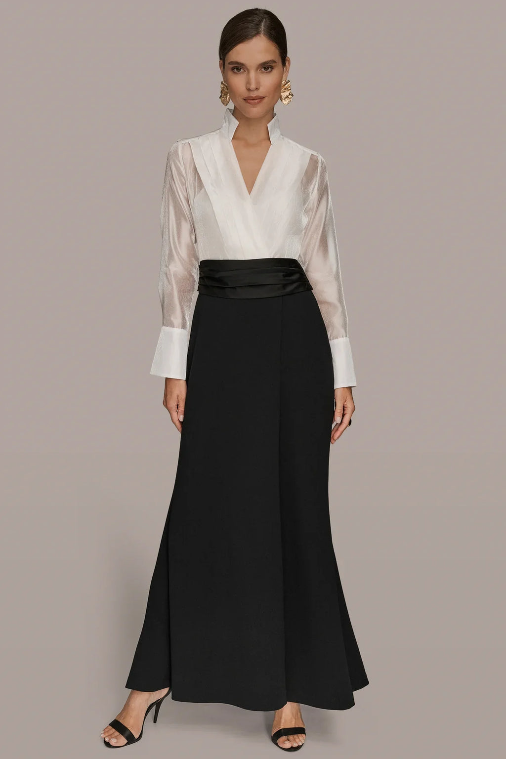 Layered wrap tuxedo evening gown featuring a sheer pleated bodice, perfect for formal occasions and elegant events. 1