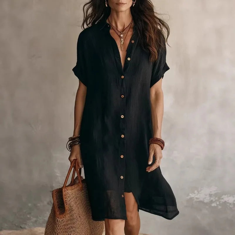 Lightweight white midi dress featuring a button-down front and a relaxed fit, perfect for casual summer outings. 1