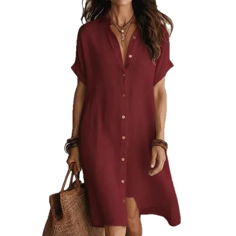 Lightweight white midi dress featuring a button-down front and a relaxed fit, perfect for casual summer outings. 4
