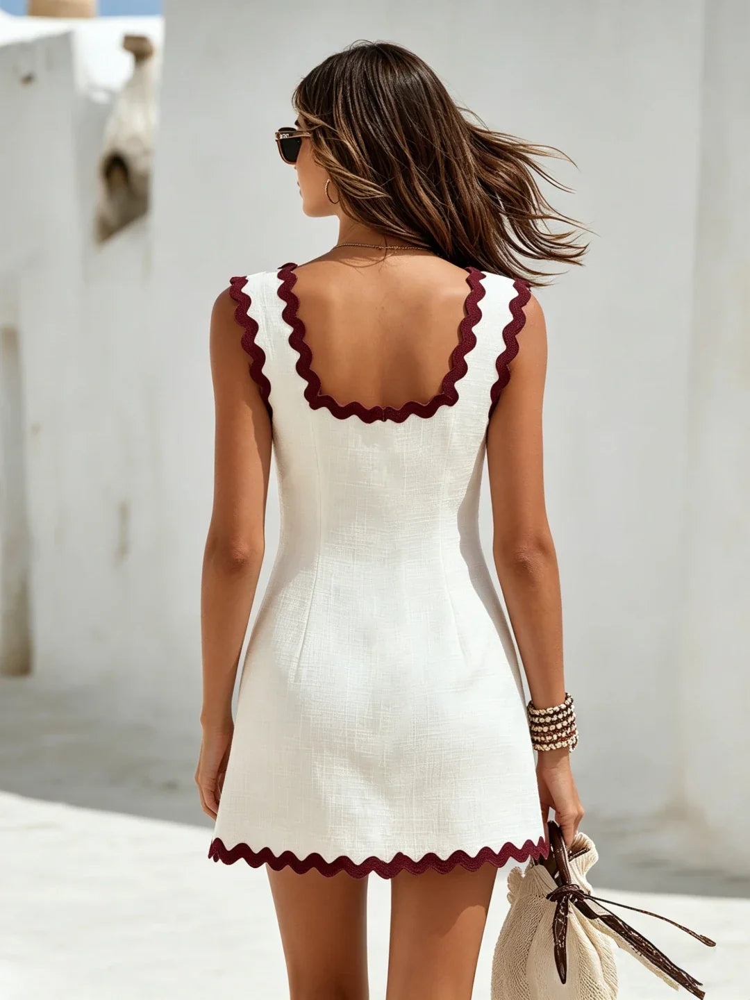 Sleeveless mini dress for women featuring a square neck design and scalloped trim, perfect for stylish summer outings. 3