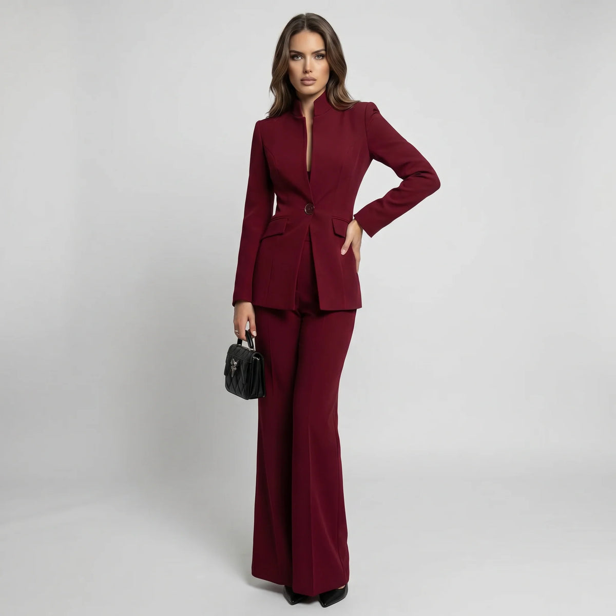 Tailored women's suit set featuring a stylish high collar blazer and elegant wide-leg trousers, perfect for professional and formal occasions. 4