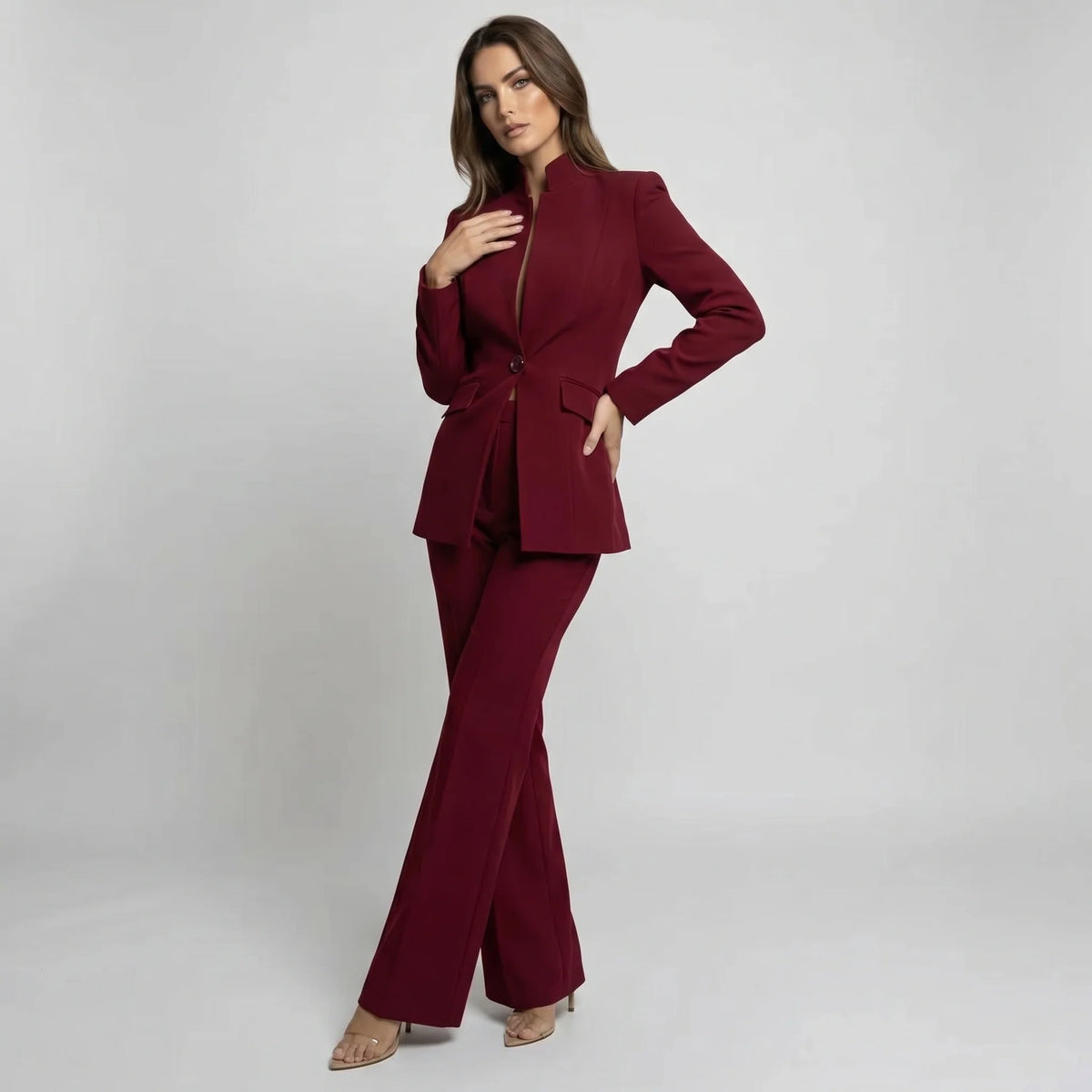 Tailored women's suit set featuring a stylish high collar blazer and elegant wide-leg trousers, perfect for professional and formal occasions. 5