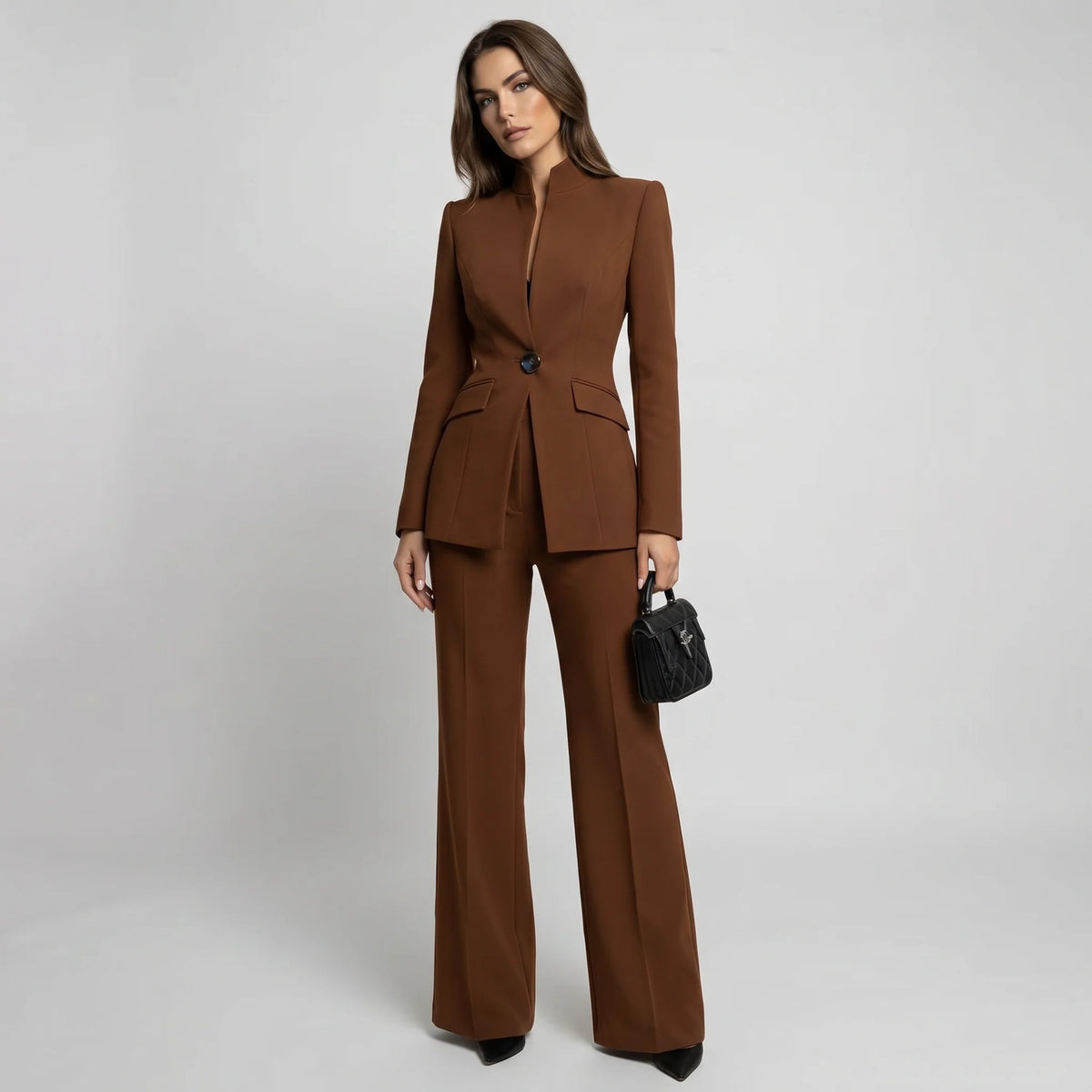 Tailored women's suit set featuring a stylish high collar blazer and elegant wide-leg trousers, perfect for professional and formal occasions. 7