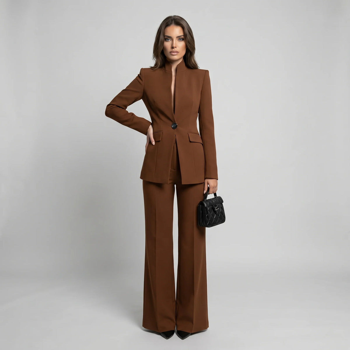 Tailored women's suit set featuring a stylish high collar blazer and elegant wide-leg trousers, perfect for professional and formal occasions. 8
